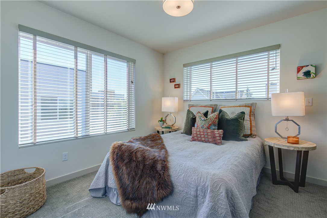 4262 Linden Avenue North Seattle, WA 98103 - Photo 28 of 40 a bedroom with bed and window