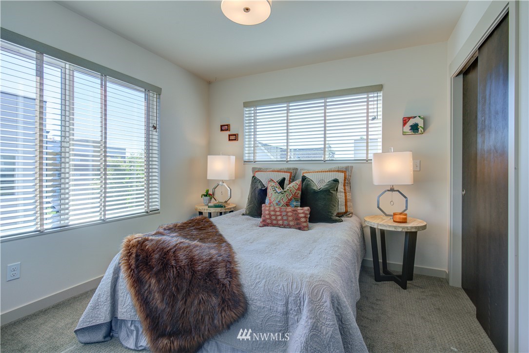4262 Linden Avenue North Seattle, WA 98103 - Photo 29 of 40 a bed room with a bed and a window