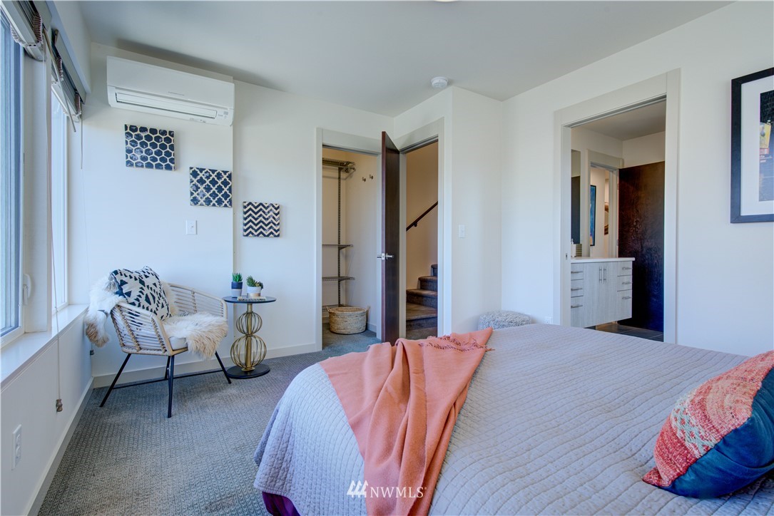 4262 Linden Avenue North Seattle, WA 98103 - Photo 33 of 40 a bed room with a bed and a chair