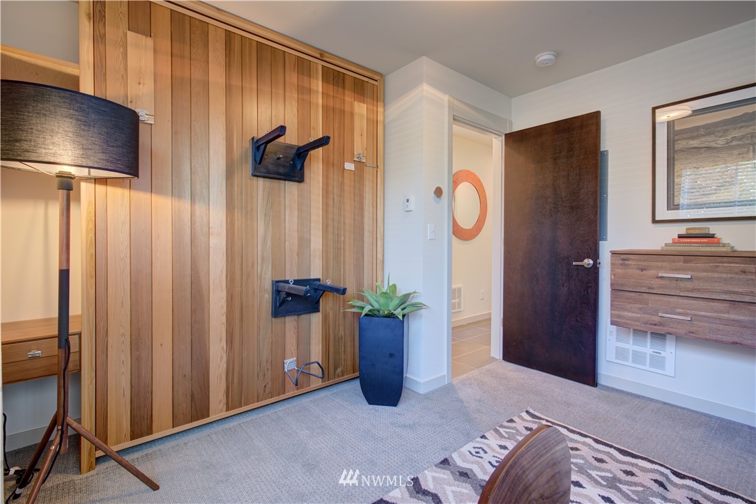 4262 Linden Avenue North Seattle, WA 98103 - Photo 7 of 40 a bedroom with furniture and a window