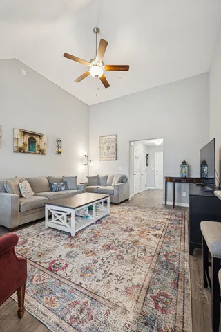 a view of a livingroom with furniture window and wooden floor