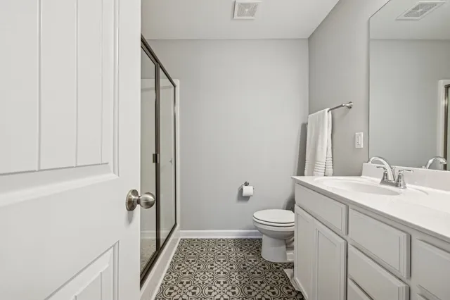 a bedroom with bed and cupboard