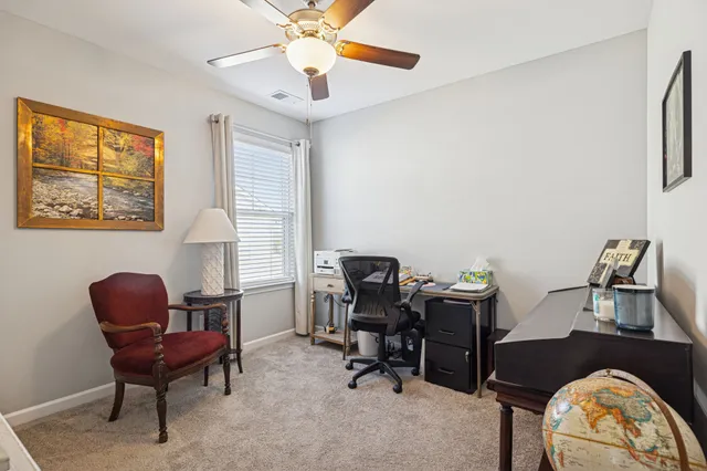 a view of a livingroom with furniture