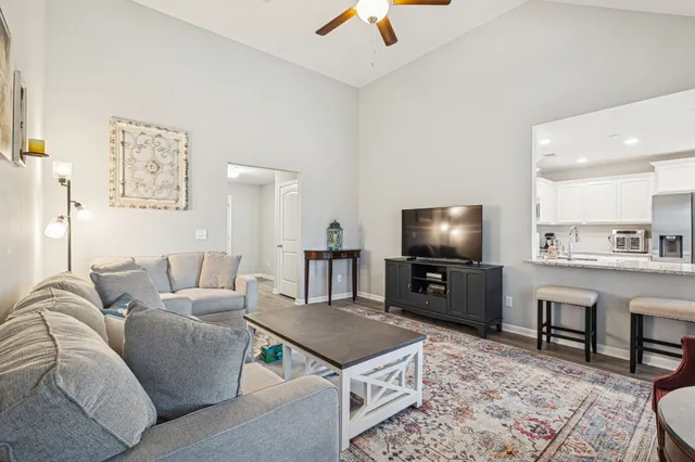 a living room with furniture and a table
