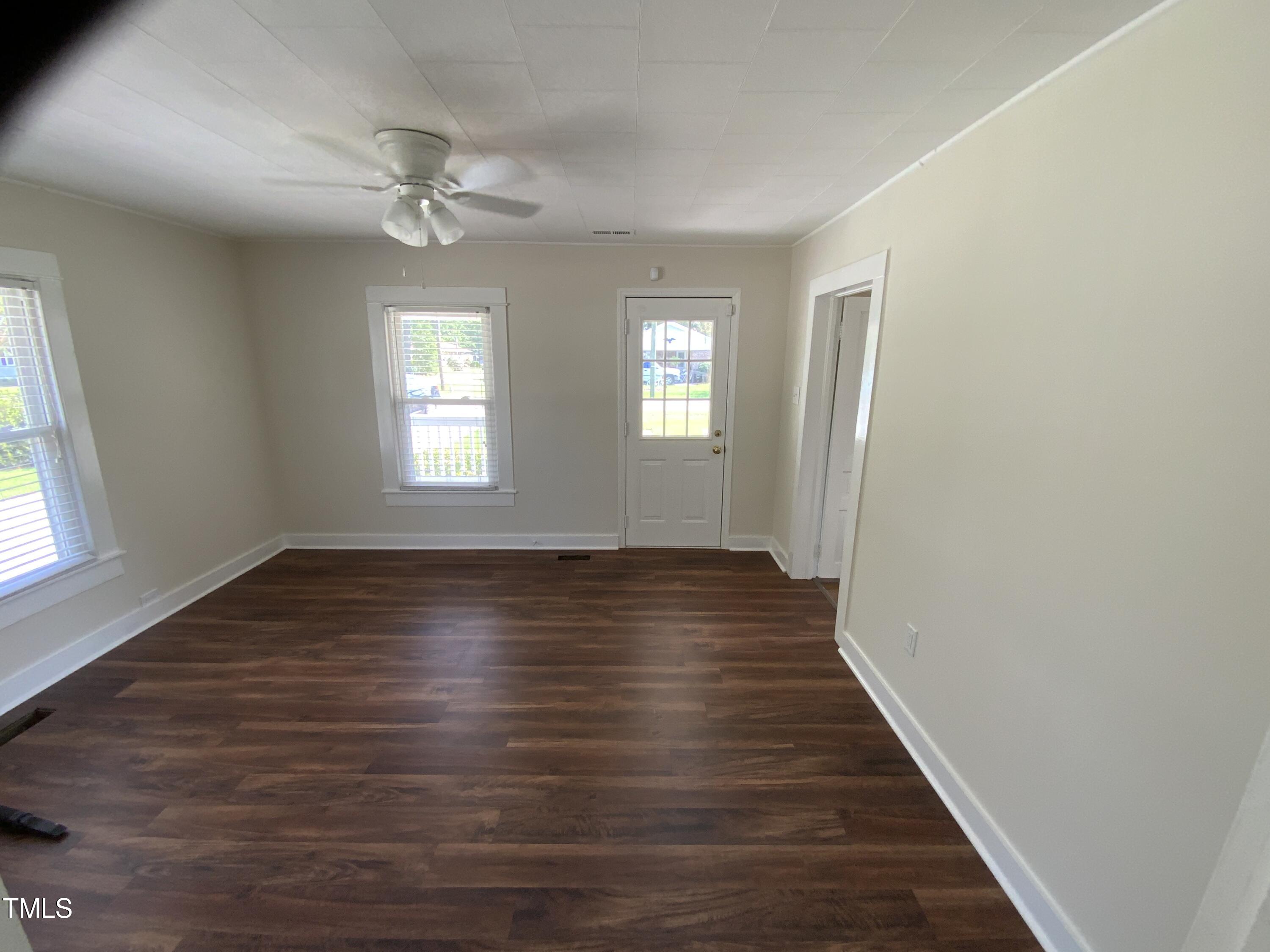 235 East Jackson Street Coats, NC 27521 - Photo 17 of 17 wooden floor in an empty room with a window