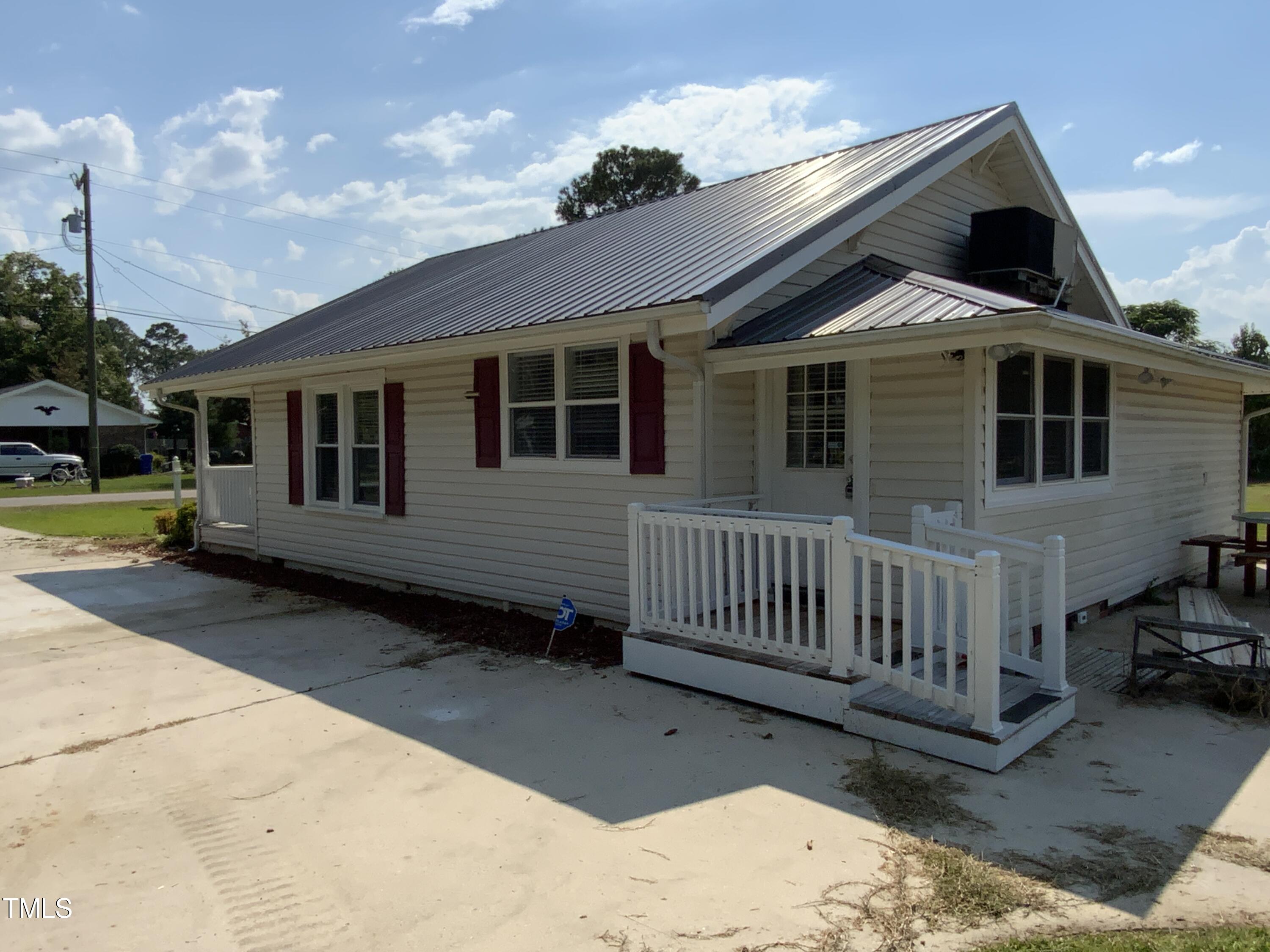 235 East Jackson Street Coats, NC 27521 - Photo 3 of 17 a view of a house with a yard