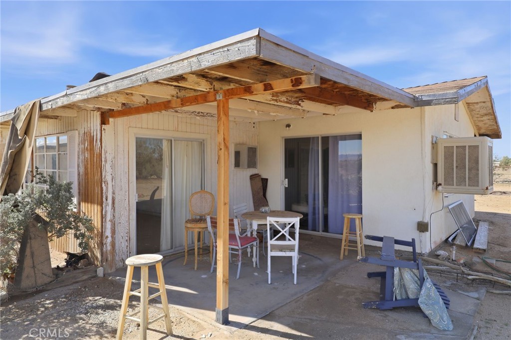 83626 Carey Road Twentynine Palms, CA 92277 - Photo 13 of 30 a view of a dinning table and chairs in the room