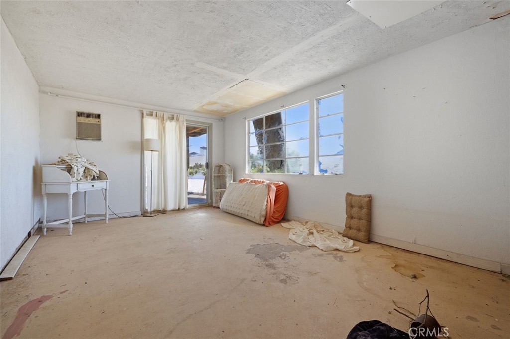 83626 Carey Road Twentynine Palms, CA 92277 - Photo 16 of 30 a view of a livingroom with an empty space and a window