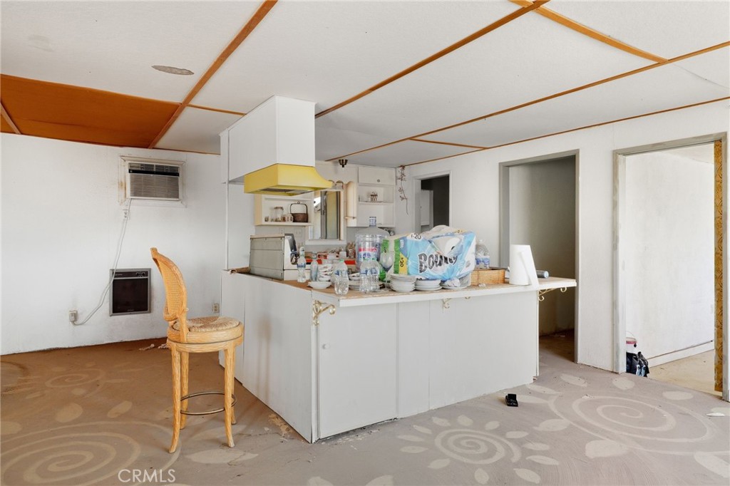 83626 Carey Road Twentynine Palms, CA 92277 - Photo 18 of 30 a living room with furniture and flowers