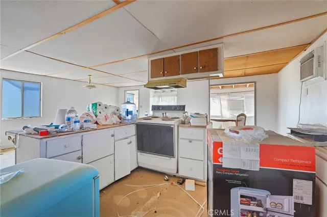 a kitchen with a stove and cabinets