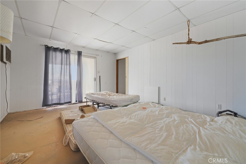 83626 Carey Road Twentynine Palms, CA 92277 - Photo 25 of 30 a bedroom with a bed and a dresser
