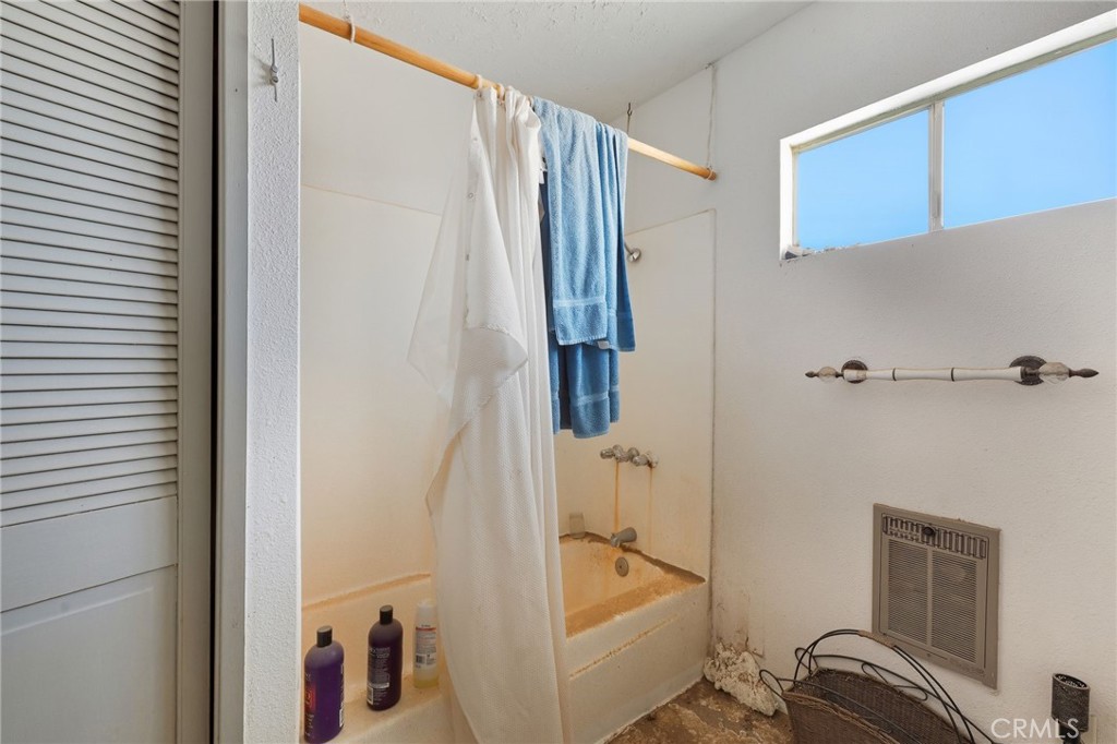 83626 Carey Road Twentynine Palms, CA 92277 - Photo 28 of 30 a bathroom with a bathtub and shower