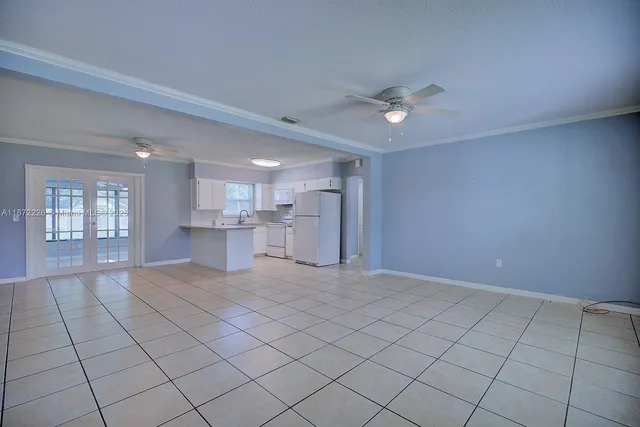 a view of an empty room and window wooden floor