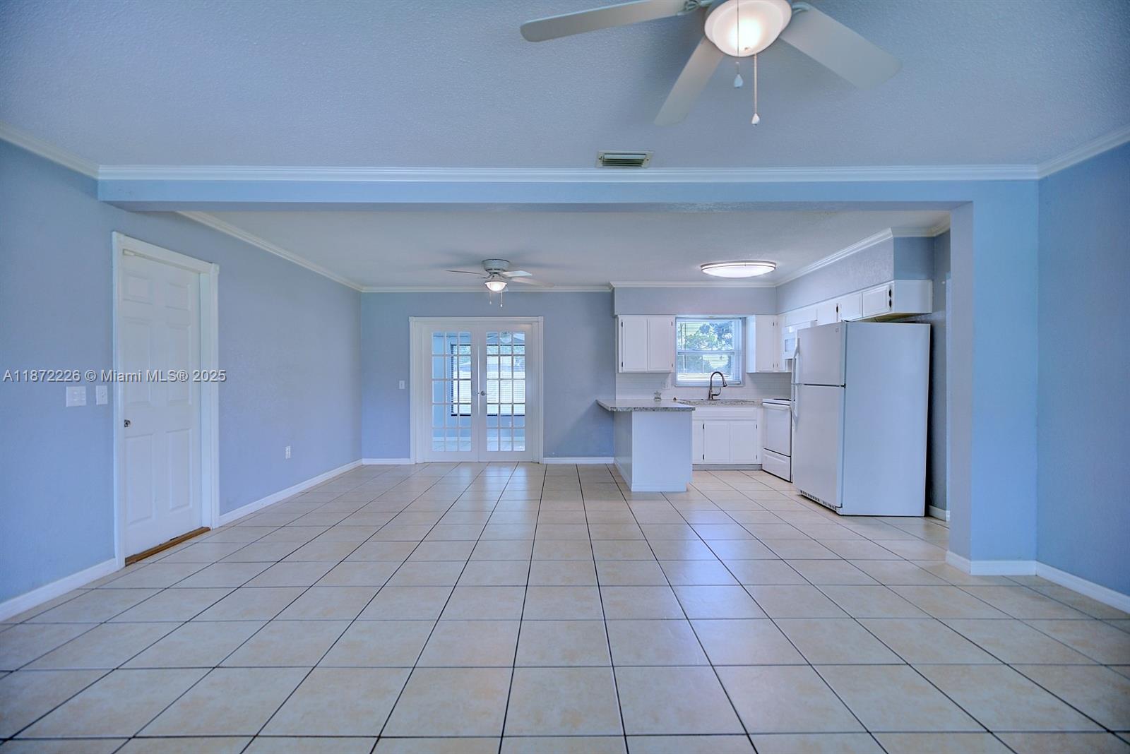 3308 Austin Street Sebring, FL 33872 - Photo 12 of 33 a view of a kitchen with a sink and a refrigerator window