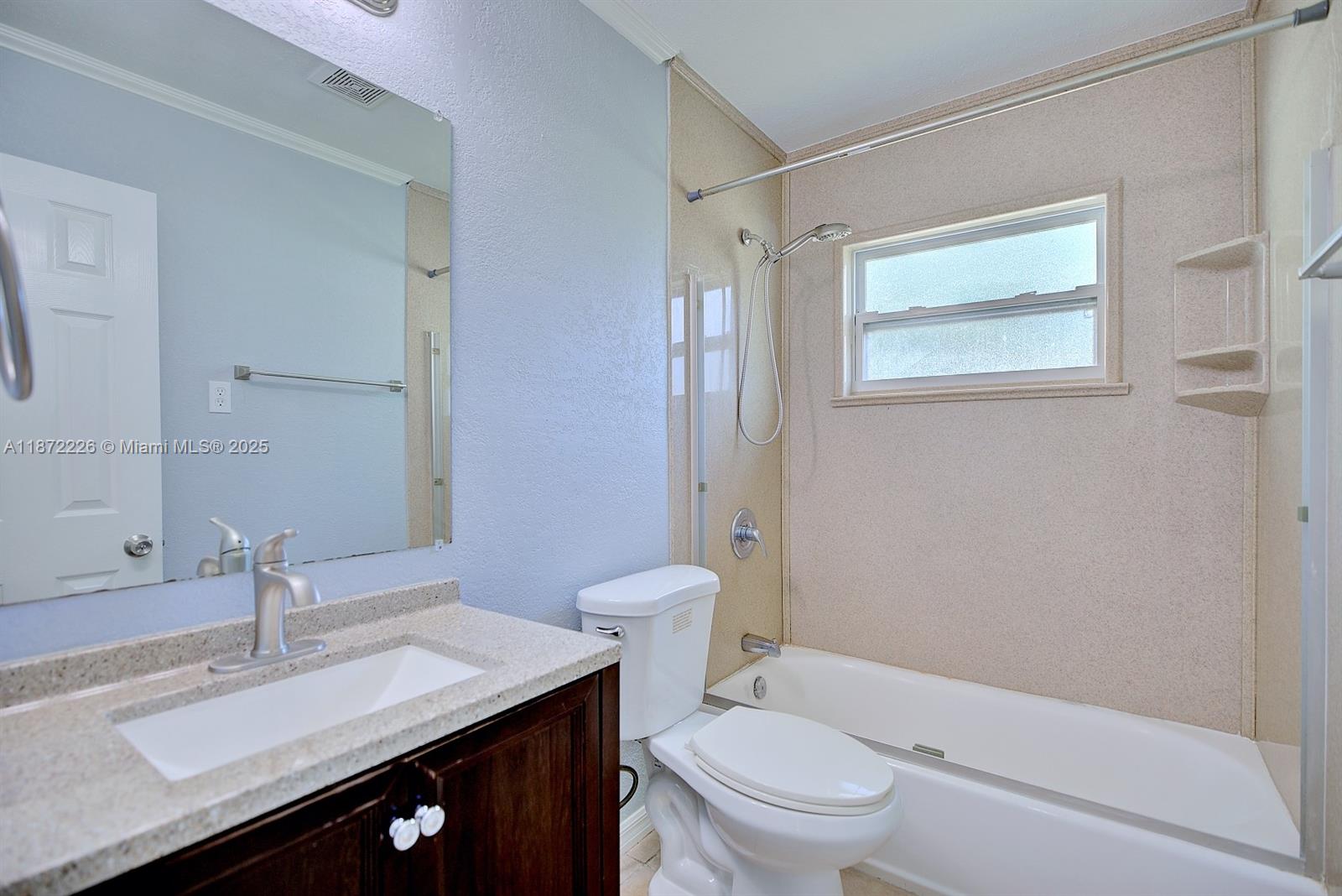 3308 Austin Street Sebring, FL 33872 - Photo 20 of 33 a bathroom with a sink toilet vanity and shower