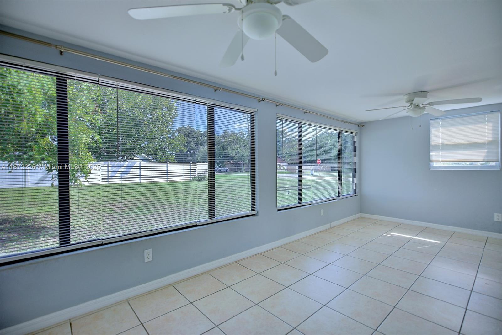 3308 Austin Street Sebring, FL 33872 - Photo 28 of 33 a view of empty room with wooden floor and fan