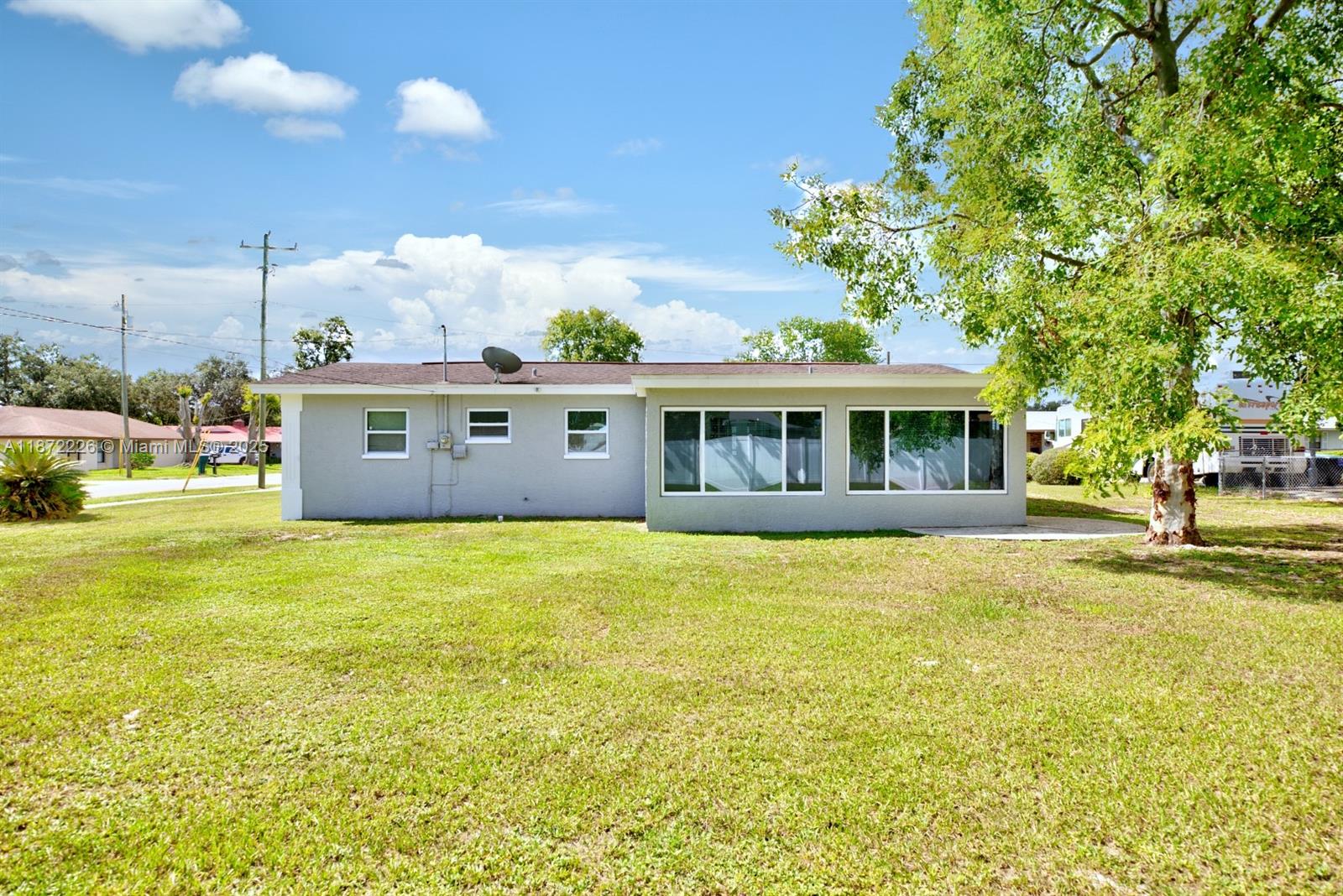 3308 Austin Street Sebring, FL 33872 - Photo 31 of 33 a view of a house with a yard
