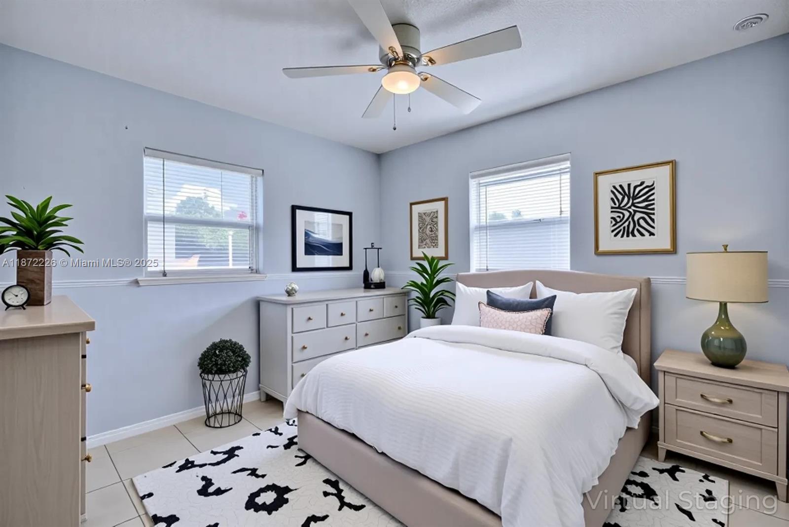 3308 Austin Street Sebring, FL 33872 - Photo 9 of 33 a bedroom with a bed and a chandelier