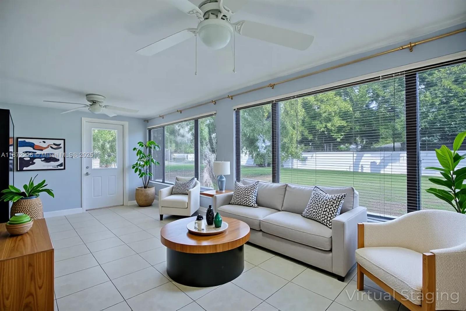 3308 Austin Street Sebring, FL 33872 - Photo 10 of 33 a living room with patio furniture and a potted plant
