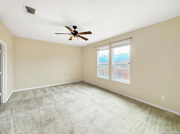 a view of an empty room with a window