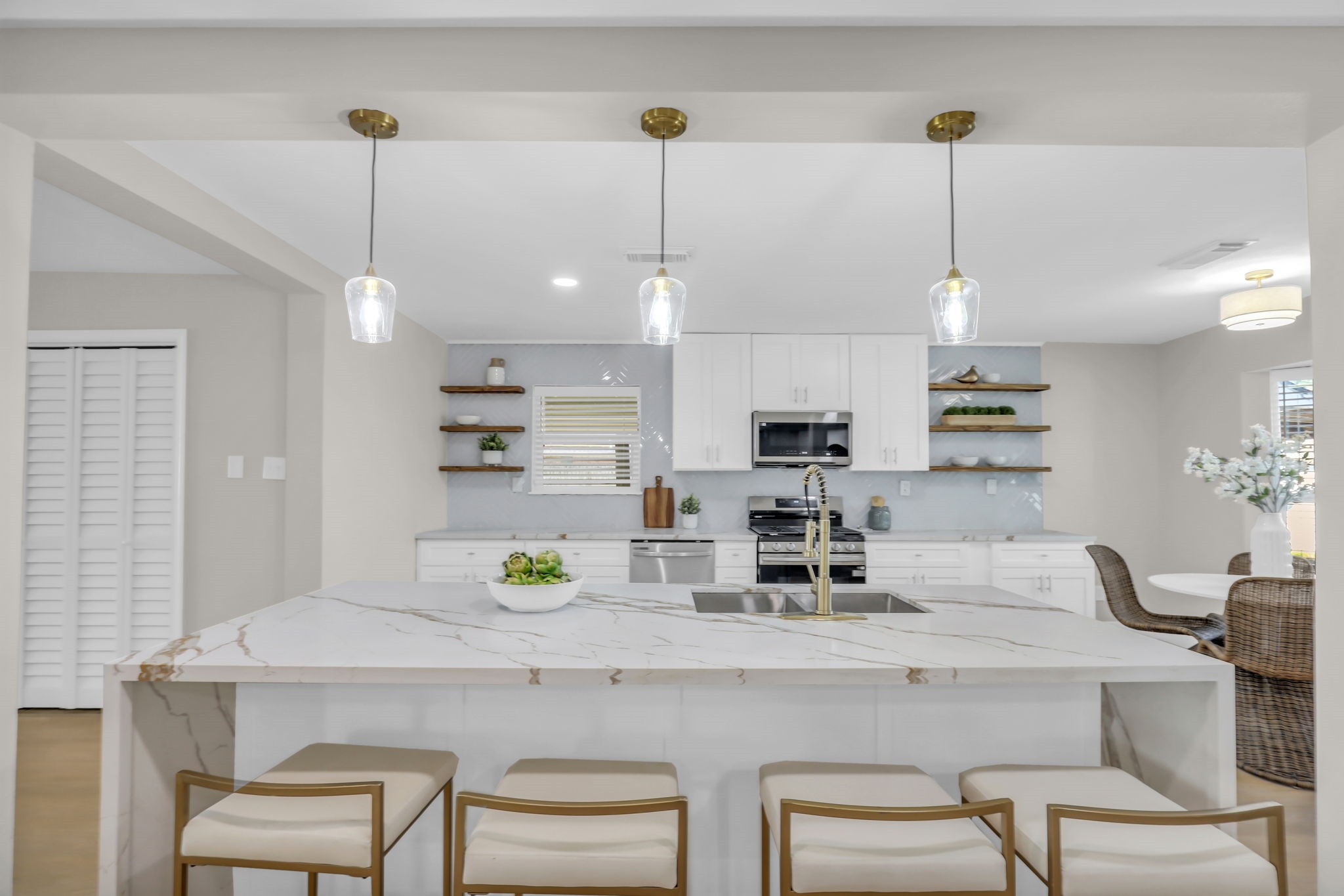 12106 Giusti Lane Santa Fe, TX 77510 - Photo 11 of 33 a kitchen with a refrigerator a dining table and chairs