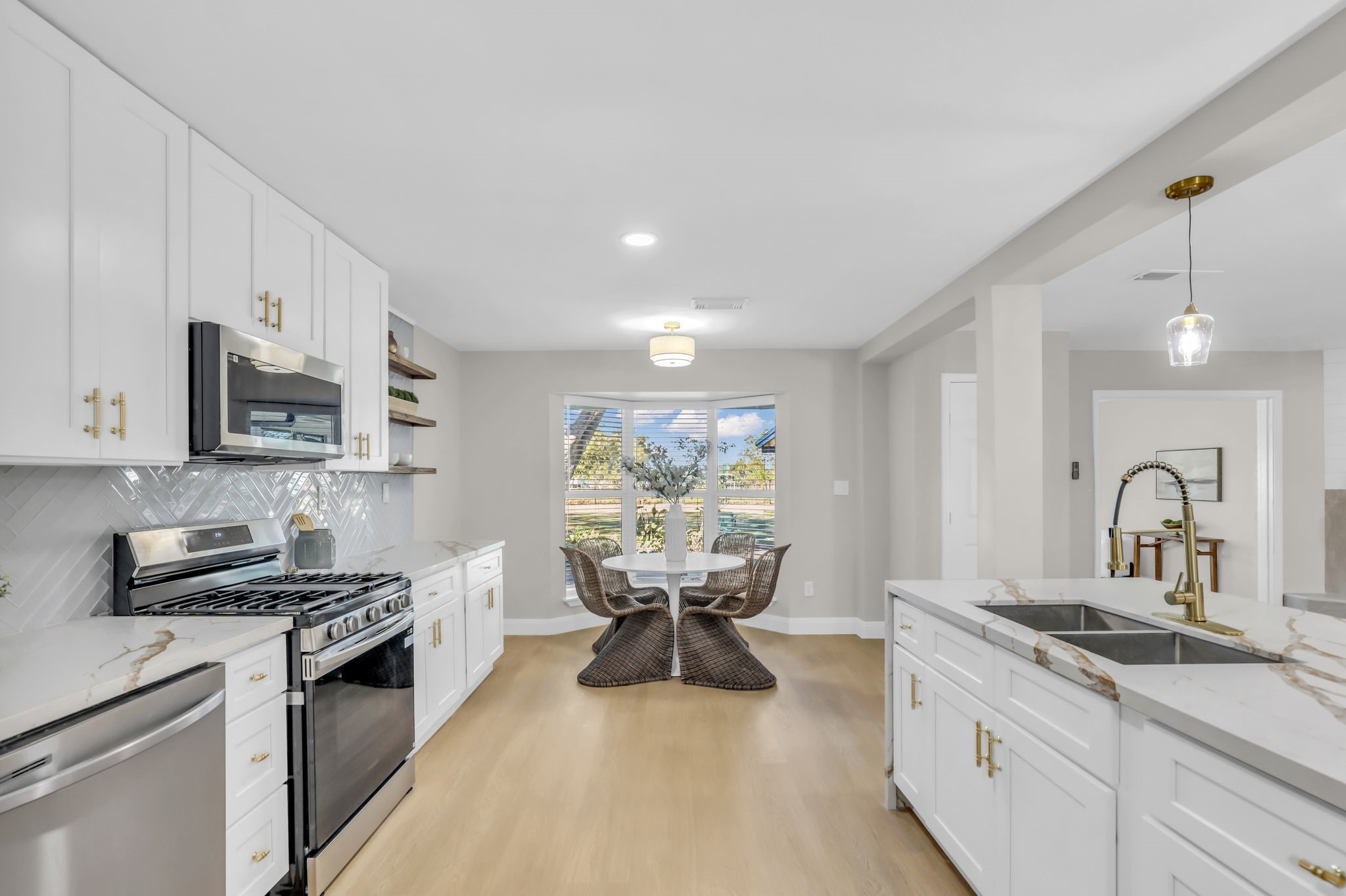 12106 Giusti Lane Santa Fe, TX 77510 - Photo 13 of 33 a kitchen with stainless steel appliances a sink stove and cabinets