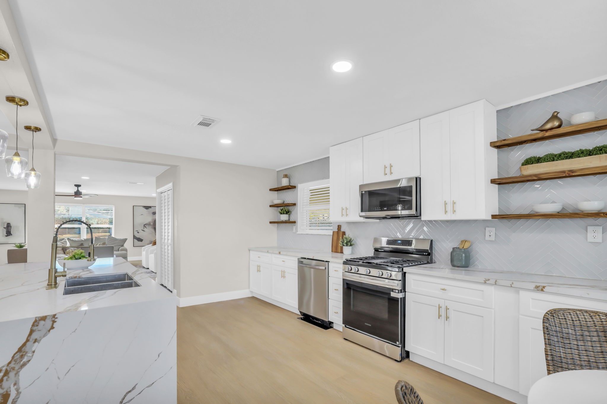 12106 Giusti Lane Santa Fe, TX 77510 - Photo 14 of 33 a kitchen with granite countertop a stove top oven sink and cabinets