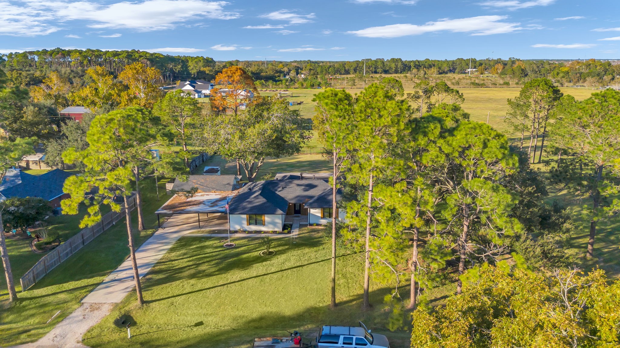 12106 Giusti Lane Santa Fe, TX 77510 - Photo 2 of 33 a view of a balcony with chair and table