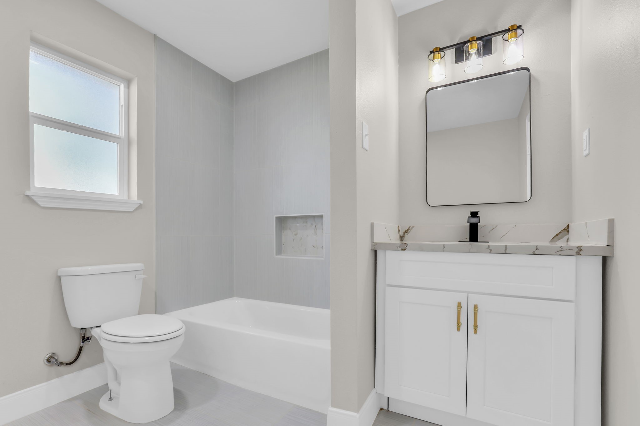 12106 Giusti Lane Santa Fe, TX 77510 - Photo 28 of 33 a bathroom with a toilet sink and mirror