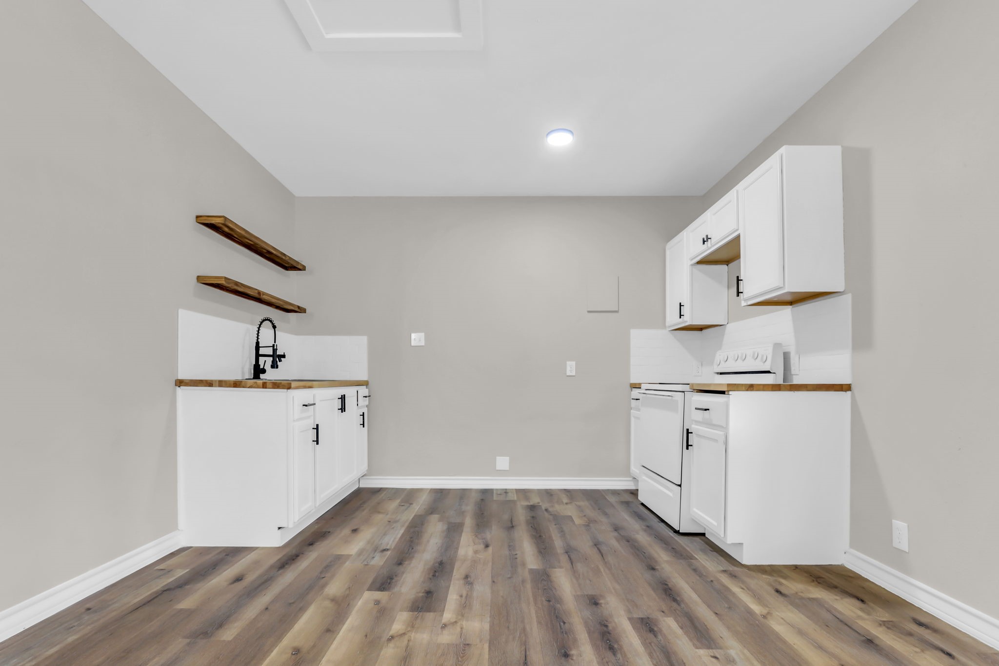 12106 Giusti Lane Santa Fe, TX 77510 - Photo 30 of 33 a kitchen with granite countertop white cabinets and white appliances
