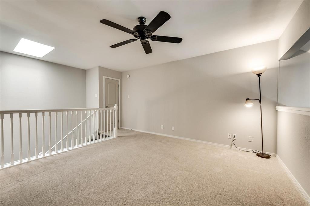 18240 Midway Road, Unit 302 Dallas, TX 75287 - Photo 19 of 33 a view of a livingroom with a ceiling fan
