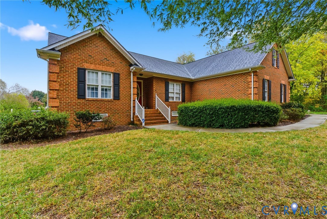 8420 Lee Davis Road Mechanicsville, VA 23116 - Photo 2 of 42 a front view of a house with garden