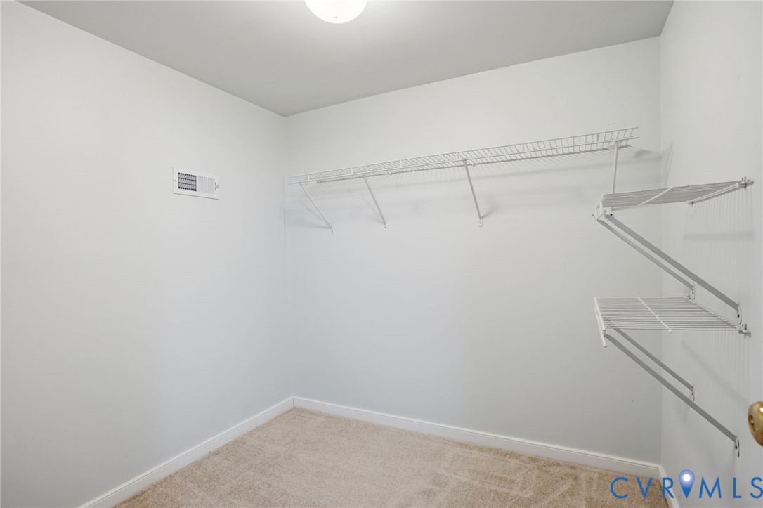 8420 Lee Davis Road Mechanicsville, VA 23116 - Photo 24 of 42 a view of a room with racks on the wall