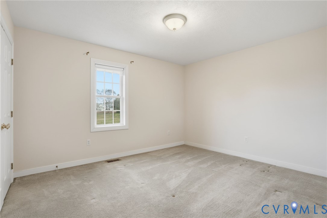 8420 Lee Davis Road Mechanicsville, VA 23116 - Photo 25 of 42 an empty room with a window