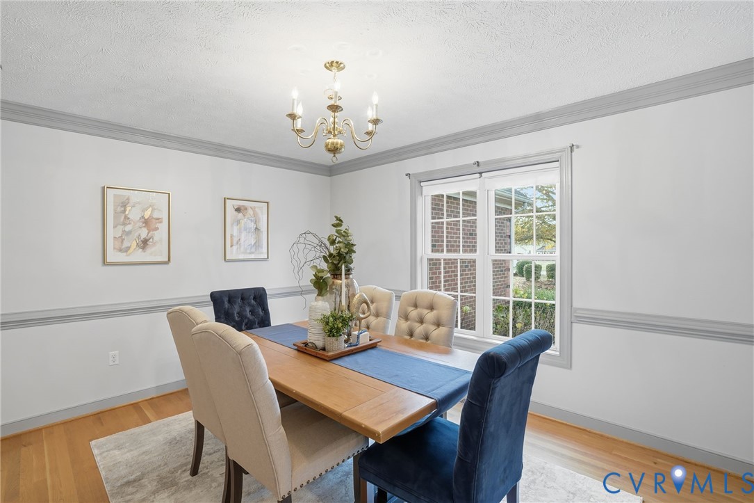8420 Lee Davis Road Mechanicsville, VA 23116 - Photo 4 of 42 a view of a dining room with furniture window and wooden floor