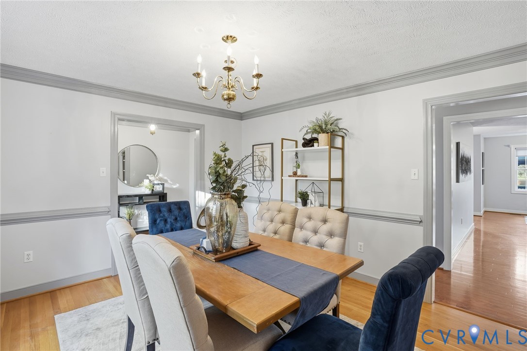 8420 Lee Davis Road Mechanicsville, VA 23116 - Photo 6 of 42 a view of a dining room with furniture and wooden floor