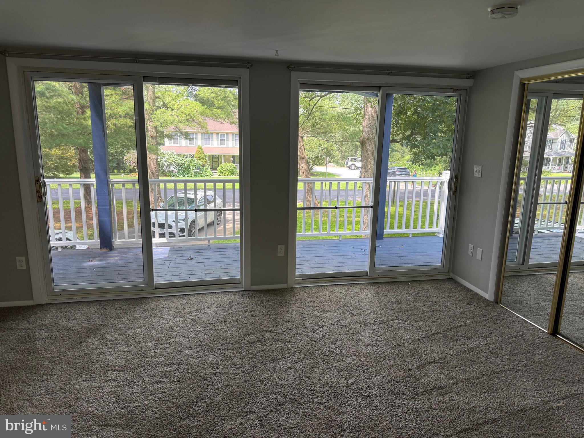 3399 Murray Road Finksburg, MD 21048 - Photo 24 of 27 a view of an empty room with wooden floor and a floor to ceiling window