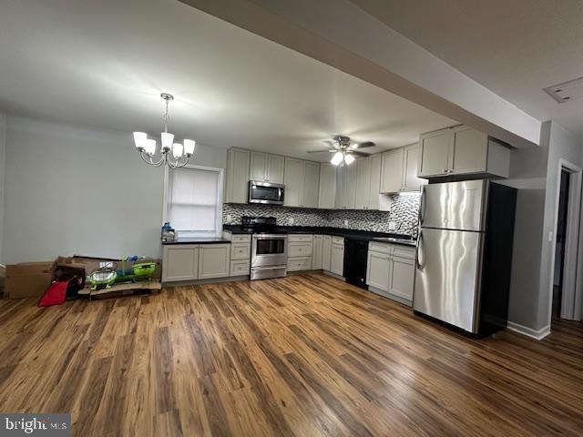 3399 Murray Road Finksburg, MD 21048 - Photo 9 of 27 a kitchen with granite countertop a refrigerator oven a sink dishwasher and a stove with wooden floor