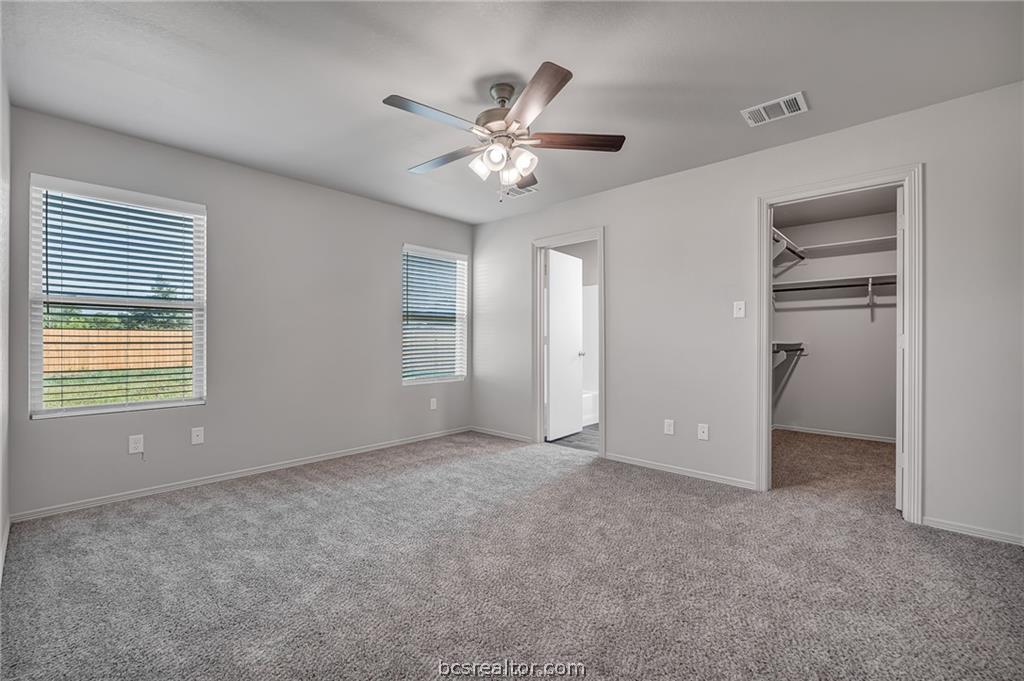 1629 Lucky Street Bryan, TX 77807 - Photo 9 of 11 a view of an empty room with a ceiling fan