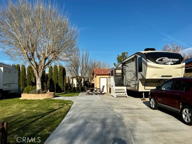 a view of a street with a car parked in front of it