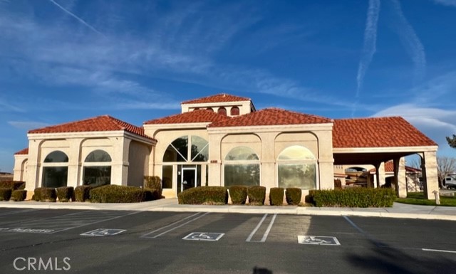 11575 Wedgewood Drive Apple Valley, CA 92308 - Photo 7 of 8 a front view of a house with a yard