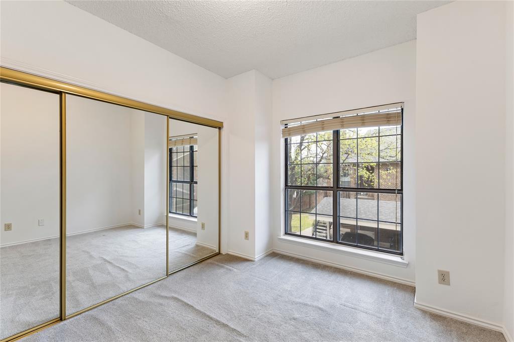 5859 Frankford Road, Unit 812 Dallas, TX 75252 - Photo 16 of 29 an empty room with sliding door and mountain view