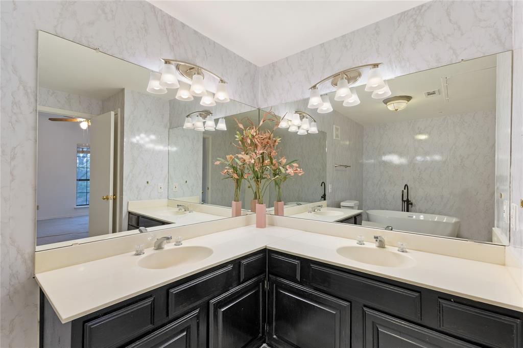 5859 Frankford Road, Unit 812 Dallas, TX 75252 - Photo 22 of 29 a bathroom with a sink double vanity and a mirror