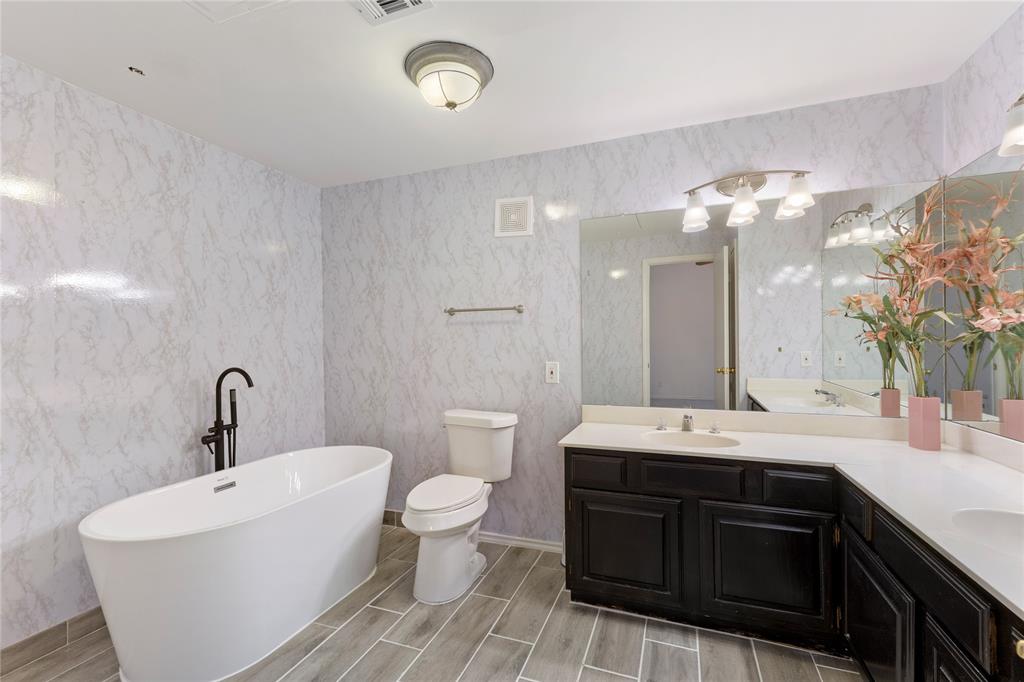 5859 Frankford Road, Unit 812 Dallas, TX 75252 - Photo 23 of 29 a spacious bathroom with a double vanity sink mirror and toilet