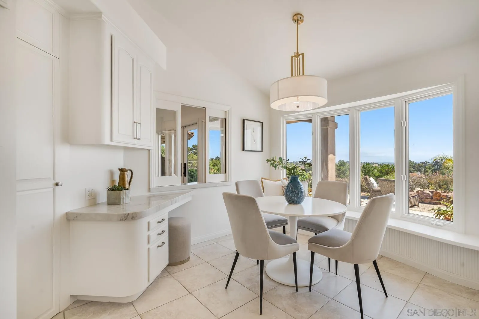 3620 Dove Hollow Road Encinitas, CA 92024 - Photo 13 of 75 a dining room with furniture a chandelier and wooden floor