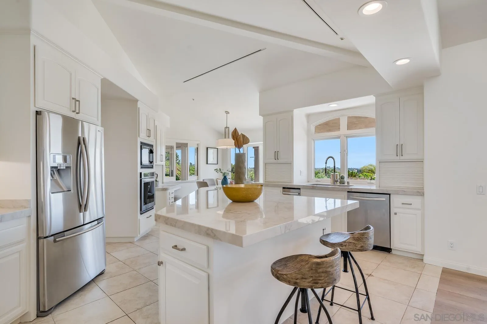 3620 Dove Hollow Road Encinitas, CA 92024 - Photo 16 of 75 a kitchen with stainless steel appliances granite countertop a refrigerator and a stove top oven