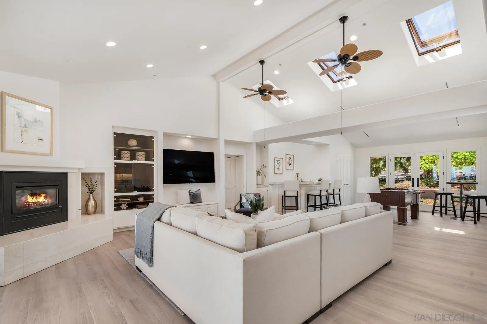 3620 Dove Hollow Road Encinitas, CA 92024 - Photo 19 of 75 a living room with furniture flat screen tv and a fireplace