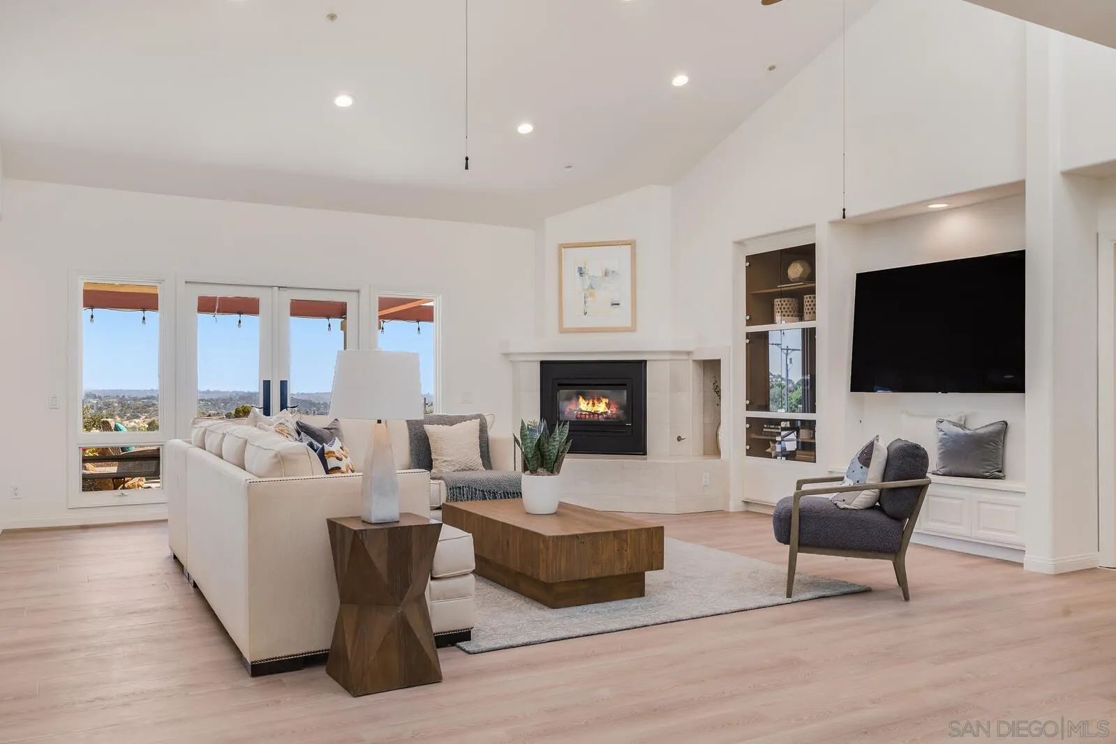 3620 Dove Hollow Road Encinitas, CA 92024 - Photo 20 of 75 a living room with fireplace furniture and a flat screen tv