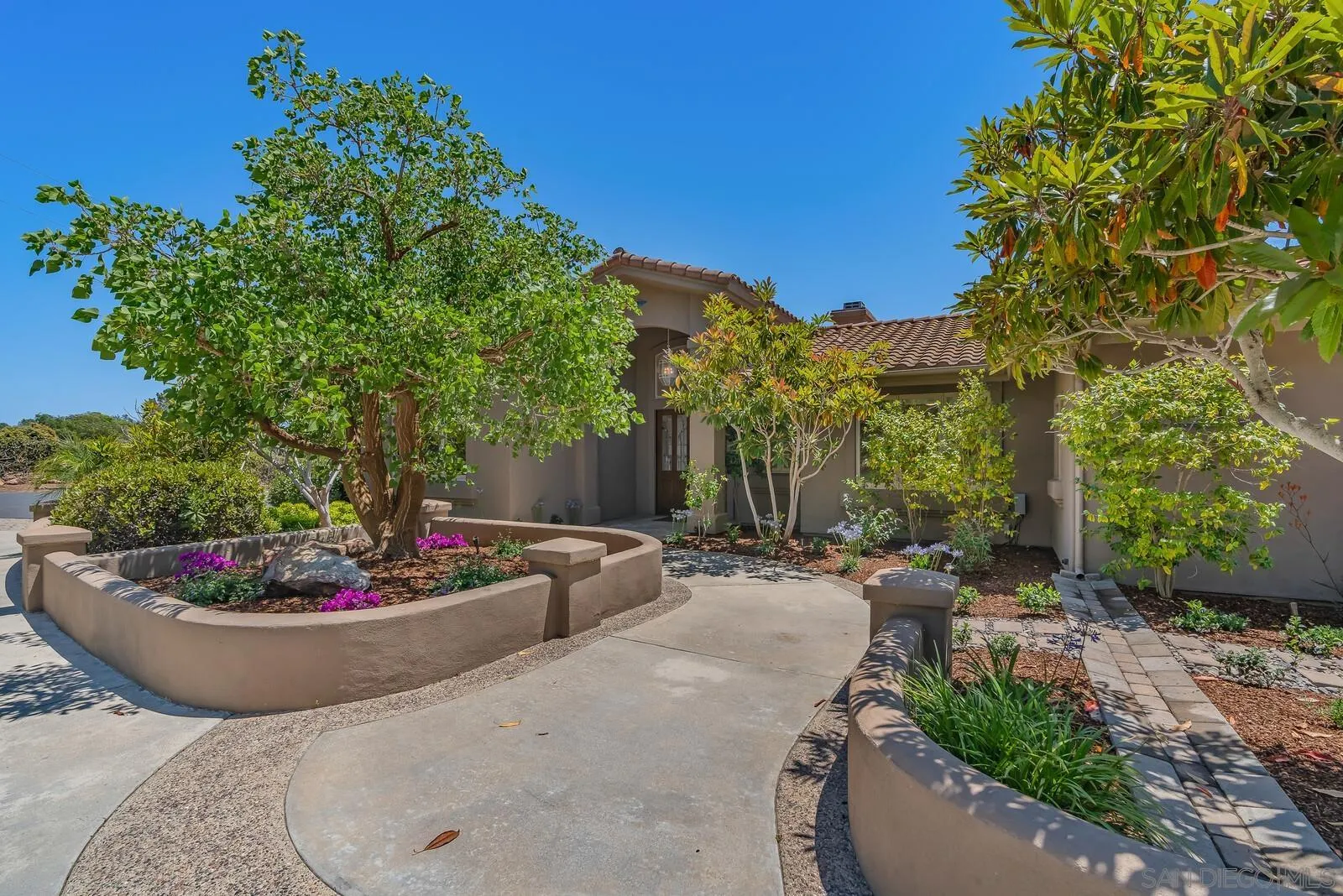 3620 Dove Hollow Road Encinitas, CA 92024 - Photo 3 of 75 a view of a backyard with plants and patio