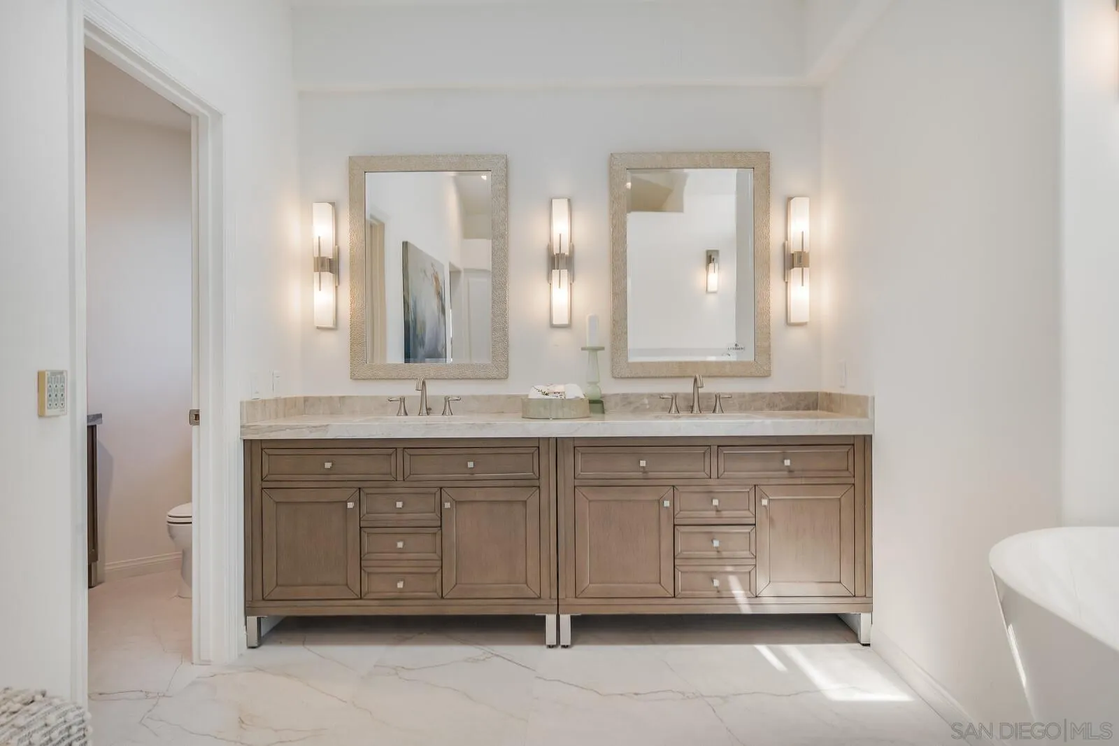 3620 Dove Hollow Road Encinitas, CA 92024 - Photo 31 of 75 a bathroom with a double vanity sink and a mirror